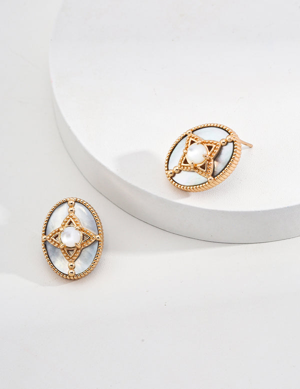 Aretes de concha extraña